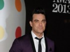Robbie Williams “soy un miembro más de One Direction”